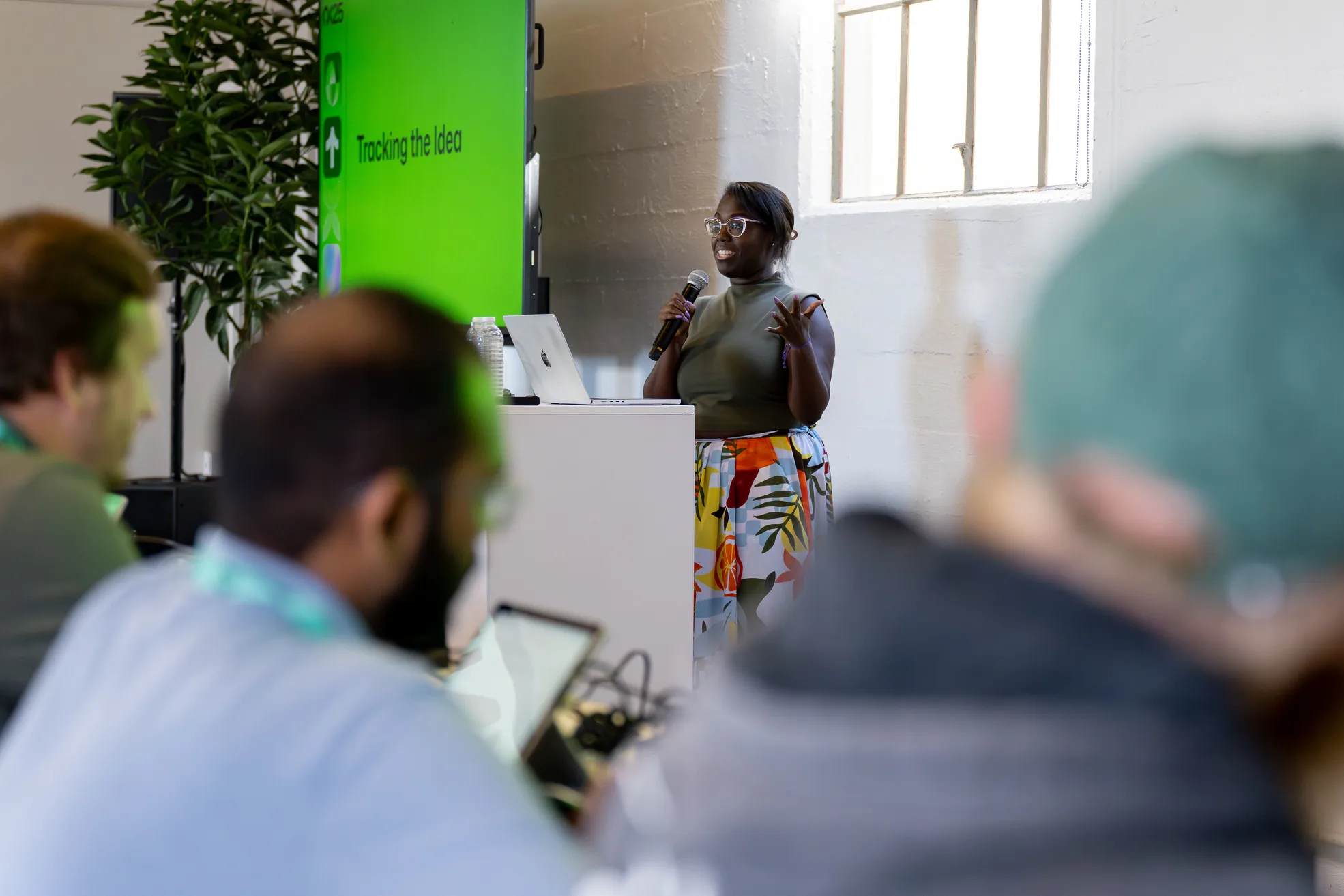 A speaker presenting to attendees at a GitHub event.